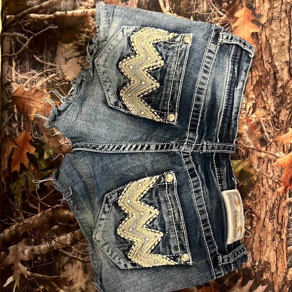 Buckle distressed jean shorts